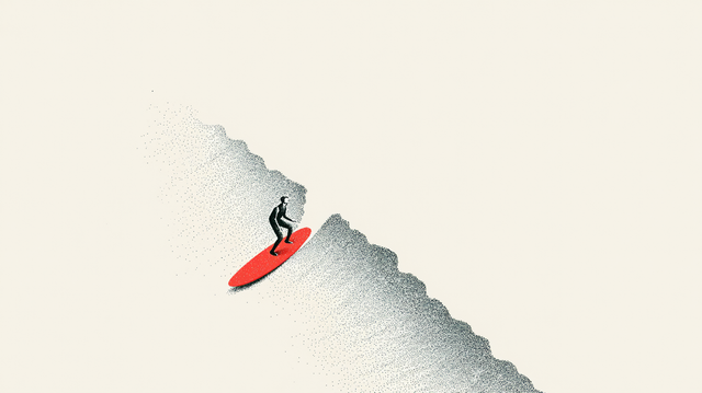 A lone figure surfing down the face of a large wave on a red surfboard